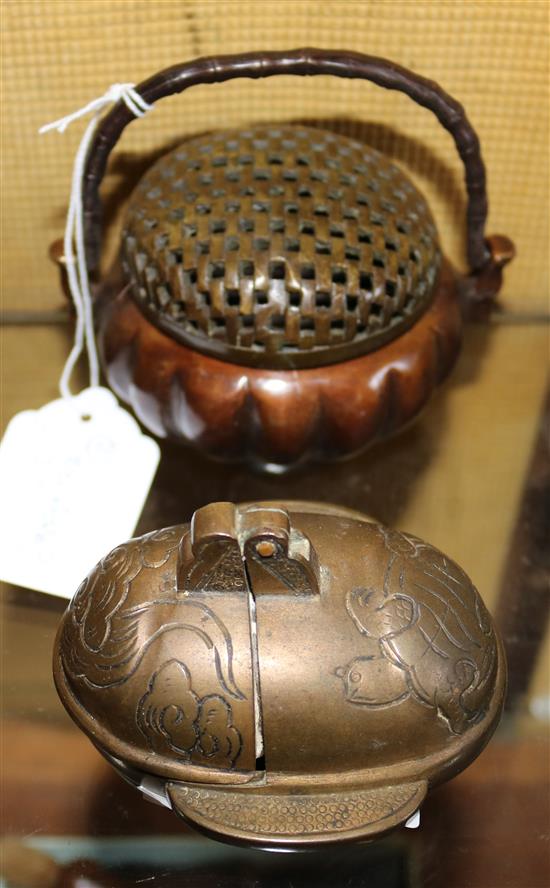 A Chinese bronze hand warmer and a Chinese bronze candle holder